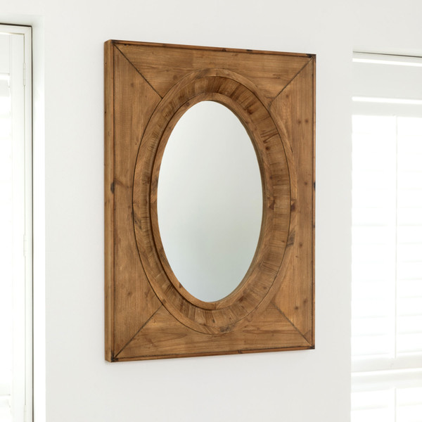 aged wooden framed oval mirror