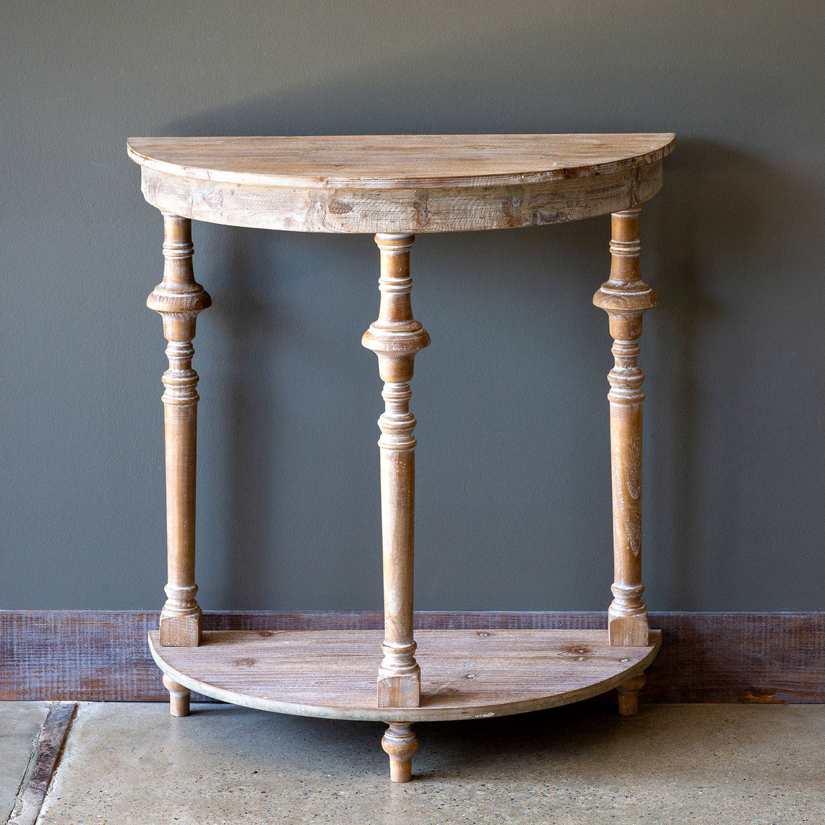 white-washed demi lune table